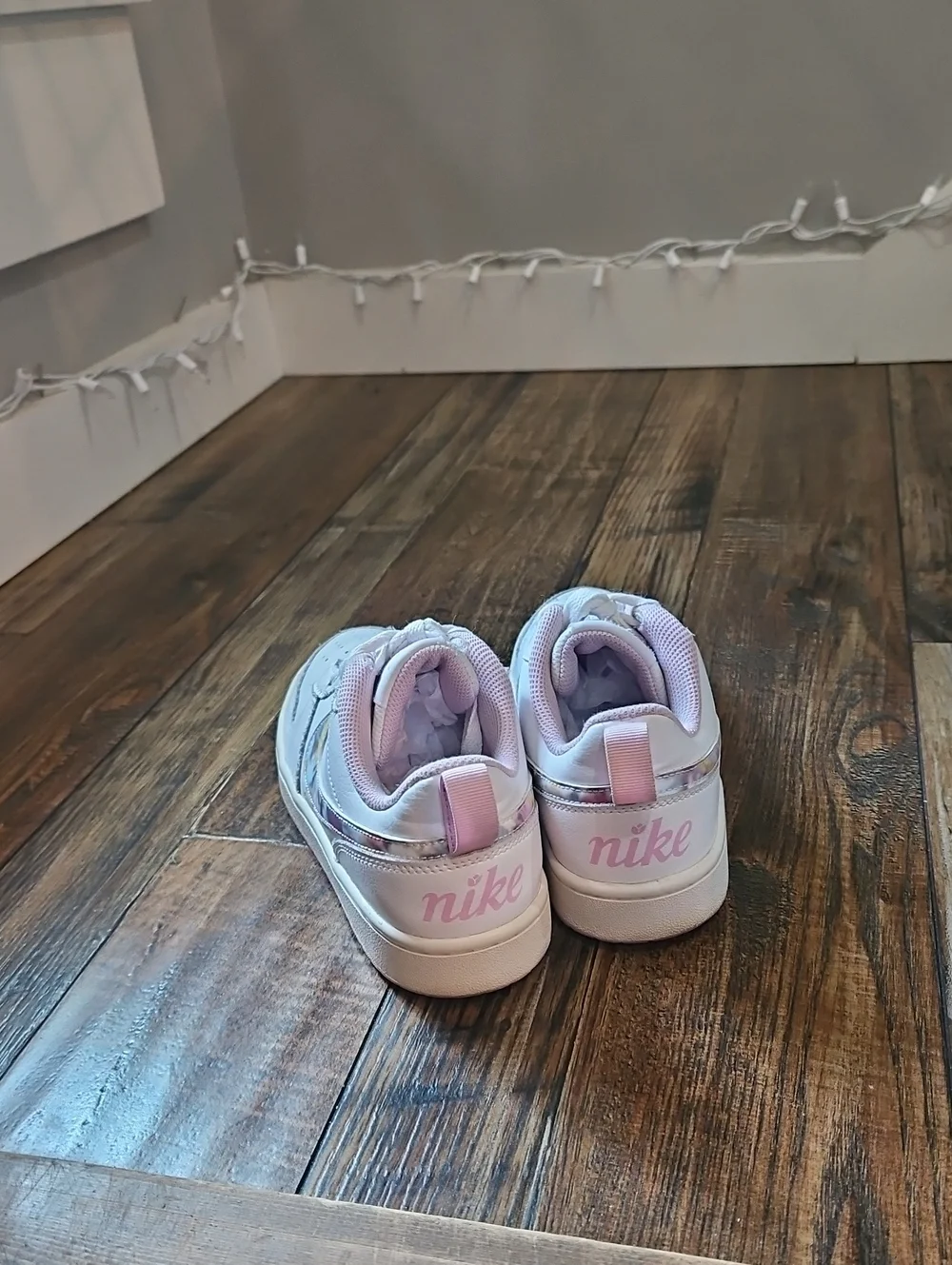 Nike White Low-Top Sneakers with Marbled Swoosh and Pink Details